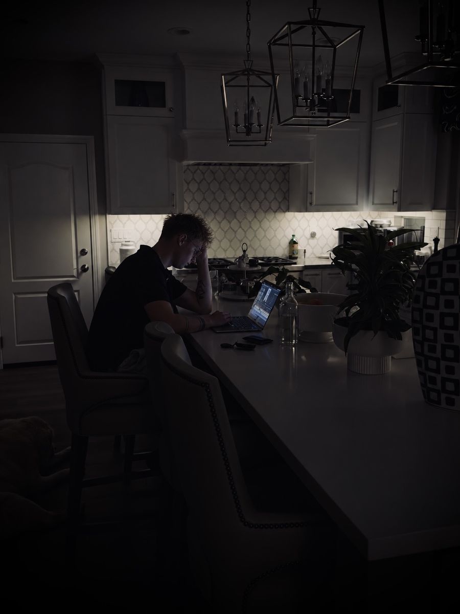 Pedro Marko. B working on a laptop late at night